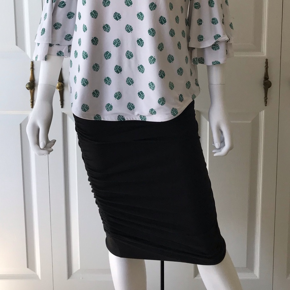 Below-the-knee black ruffle skirt
